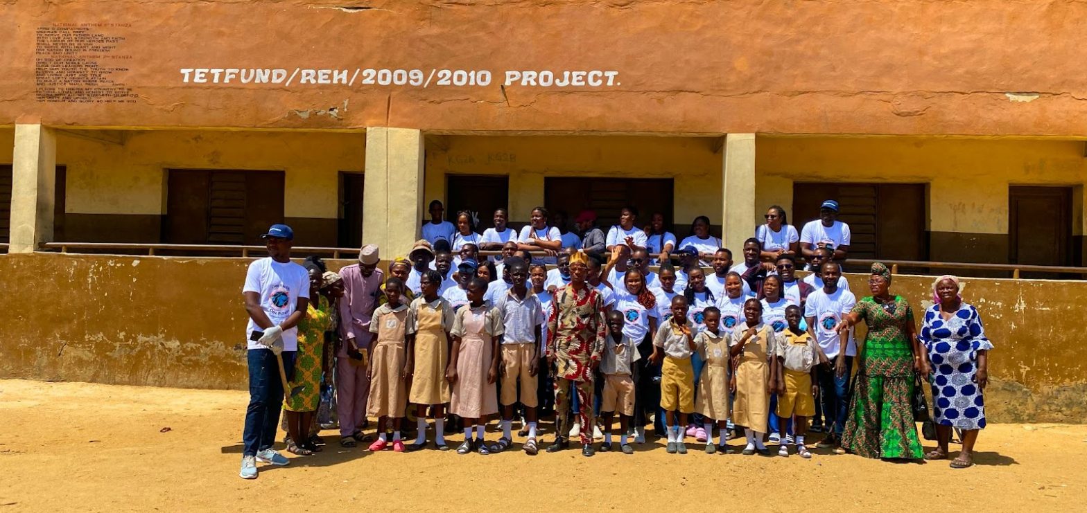 A cross-section of Flutterwave Employees, Africa Upcycle Volunteers, Pupils, and Staff of Maidan Primary School during the tree planting exercise.
